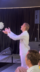 Choir performs in white and yellow at Belgrade venue