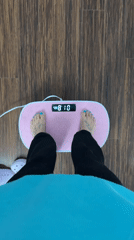 Person uses pink foot massager at home in Seal Beach