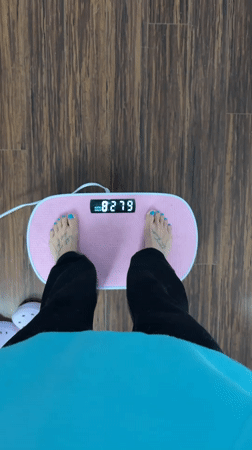 Person uses pink foot massager at home in Seal Beach
