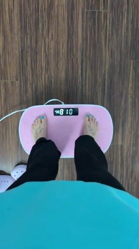 Person uses pink foot massager at home in Seal Beach