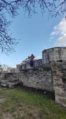 Man performs backflip off stone structure in Veliki Preslav