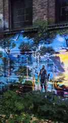 Surreal futuristic mural covers building wall in Iserlohn