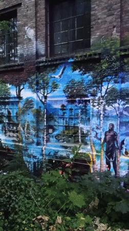 Surreal futuristic mural covers building wall in Iserlohn