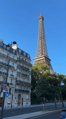 Daytime street-level view of the Eiffel Tower, Paris