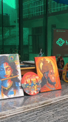 Hindu deity paintings displayed at outdoor market in Haini