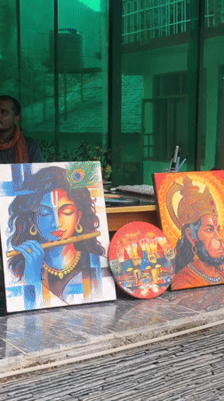 Hindu deity paintings displayed at outdoor market in Haini