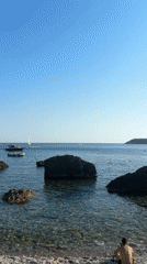 Lazy afternoon at a rocky Adriatic beach café in Montenegro