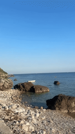 Lazy afternoon at a rocky Adriatic beach café in Montenegro