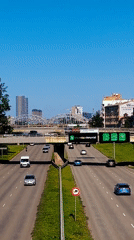 Aerial view of Riga highway traffic with city skyline behind