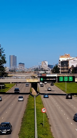 Aerial view of Riga highway traffic with city skyline behind