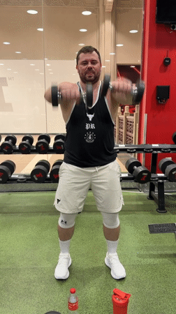 Strength training session at a Dubai gym, multiple exercises covered