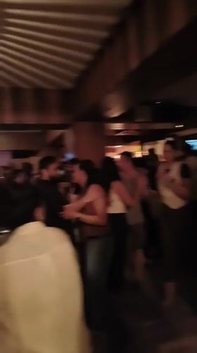 Evening crowd fills Delhi bar with dancing and socializing