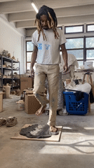 Artist works with clay in Saint-Ouen studio