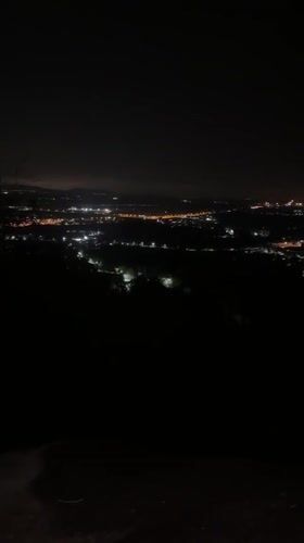 Night cityscape filmed from elevated position in Thailand