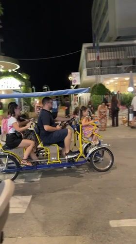 Late-night street festivities rolling through Gatteo, Italy