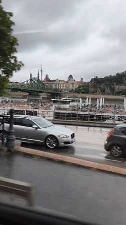River view captured from moving vehicle in Budapest
