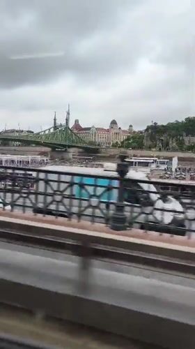 River view captured from moving vehicle in Budapest