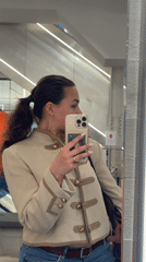 Woman takes shopping selfies near Milan Cathedral during event setup