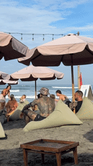 Beachgoers and locals enjoy typical day in North Kuta