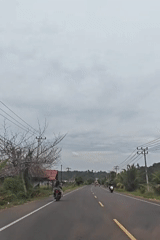 Morning traffic flows on rural Indonesian roads