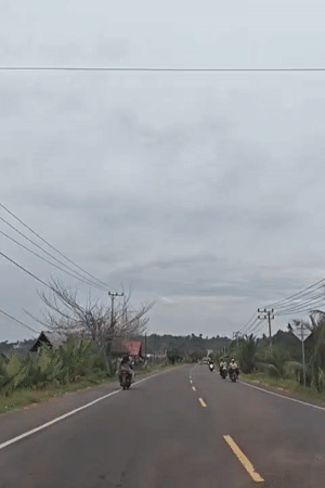 Morning traffic flows on rural Indonesian roads