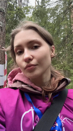 Woman films selfie on zip line course in Russian forest