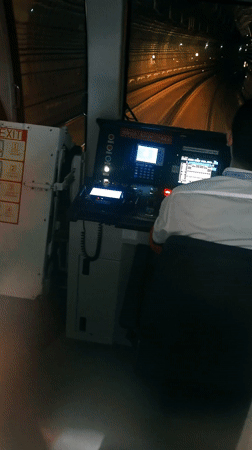 Train operator guides train through tunnel in Yuzhong District
