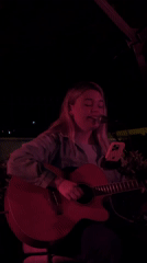 Acoustic performance captured at nighttime venue in Dobrota, Montenegro