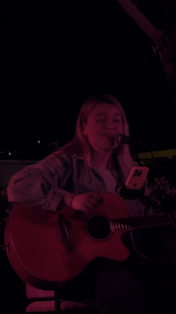 Acoustic performance captured at nighttime venue in Dobrota, Montenegro