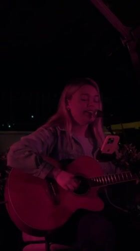 Acoustic performance captured at nighttime venue in Dobrota, Montenegro