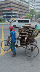 Night transport workers move goods through Dhaka intersections