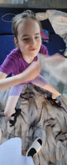Child enjoys afternoon meal at home in Krasnogorskoye