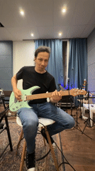 Street musician plays electric guitar in Moscow