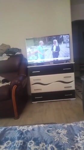 Quiet morning indoors in Minsk, TV on in the background