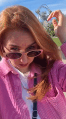 Woman in pink jacket observed outdoors in Minsk