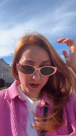 Woman in pink jacket observed outdoors in Minsk
