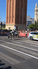 Cycling race rolls through Barcelona streets on a sunny afternoon