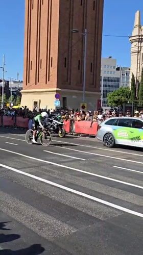 Cycling race rolls through Barcelona streets on a sunny afternoon