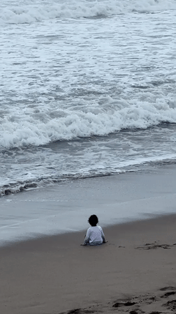 Quiet beach moments with child, mother, baby, dog in Kuta