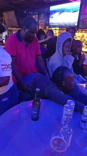 Evening social gathering at Nairobi bar with dancing and drinks