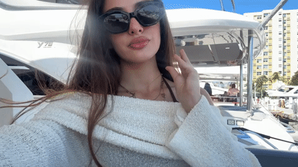 Woman takes selfie on yacht near Miami Beach