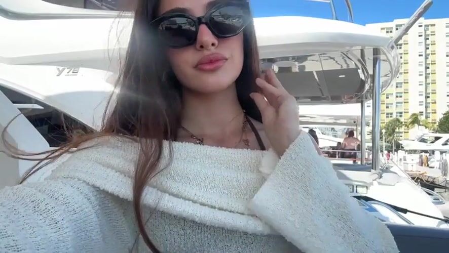 Woman takes selfie on yacht near Miami Beach