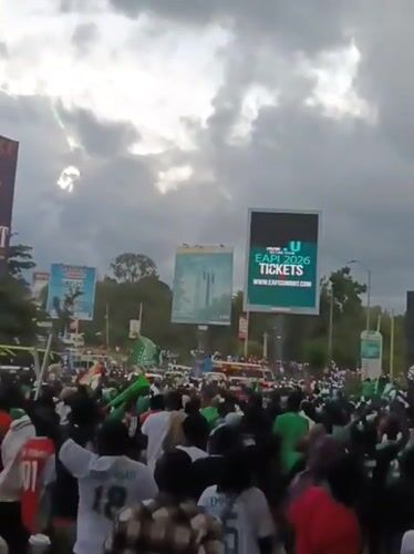 Celebrating crowd in green, white gathers on Nairobi streets