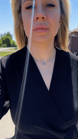 Sunny day stroll in Novoaltaysk, black dress and silver necklace