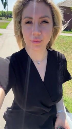 Sunny day stroll in Novoaltaysk, black dress and silver necklace