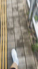 Pedestrian walks on marked sidewalk in Krasnaya Polyana