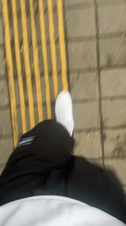 Pedestrian walks on marked sidewalk in Krasnaya Polyana