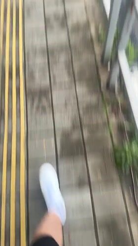 Pedestrian walks on marked sidewalk in Krasnaya Polyana