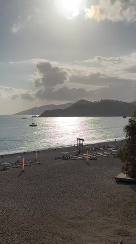 Beach activity observed in Fethiye with volleyball, walkers