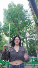 Woman poses for video in Yerevan park